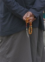 Man holding prayer b